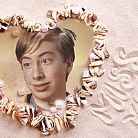 Photo effect - Heart from seashells on the sand