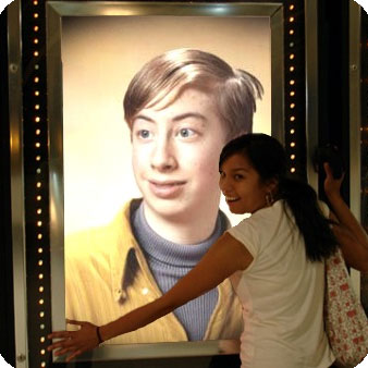 Photo effect - Girl in front of playbill with you